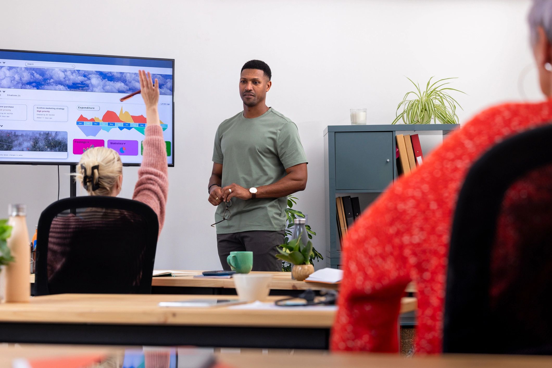 Product team reviewing design decisions in a meeting